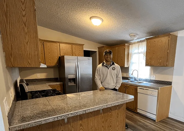 Kyle Ridge in the kitchen of a Reno home he bought for cash